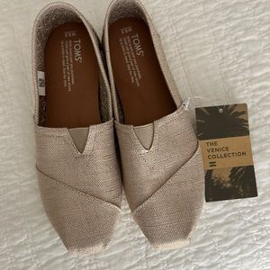 Tom’s size 8.5 classic slip ons